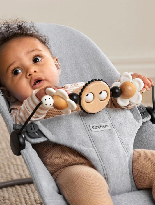 BabyBjorn Googly Eyes Toy on Bliss with rotating bar for interactive play