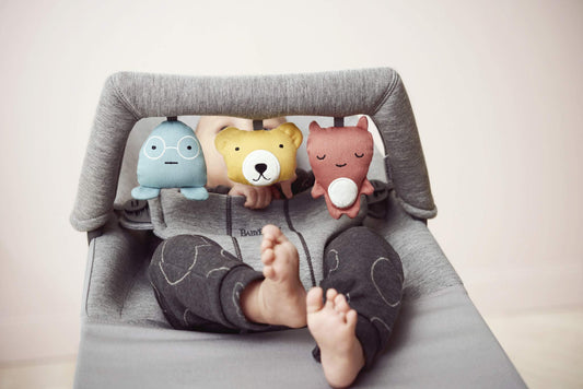 BabyBjörn Soft Friends toy attached to a bouncer for easy setup