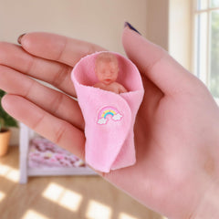 BABESIDE sleeping-face doll promoting soothing, comforting pretend play.