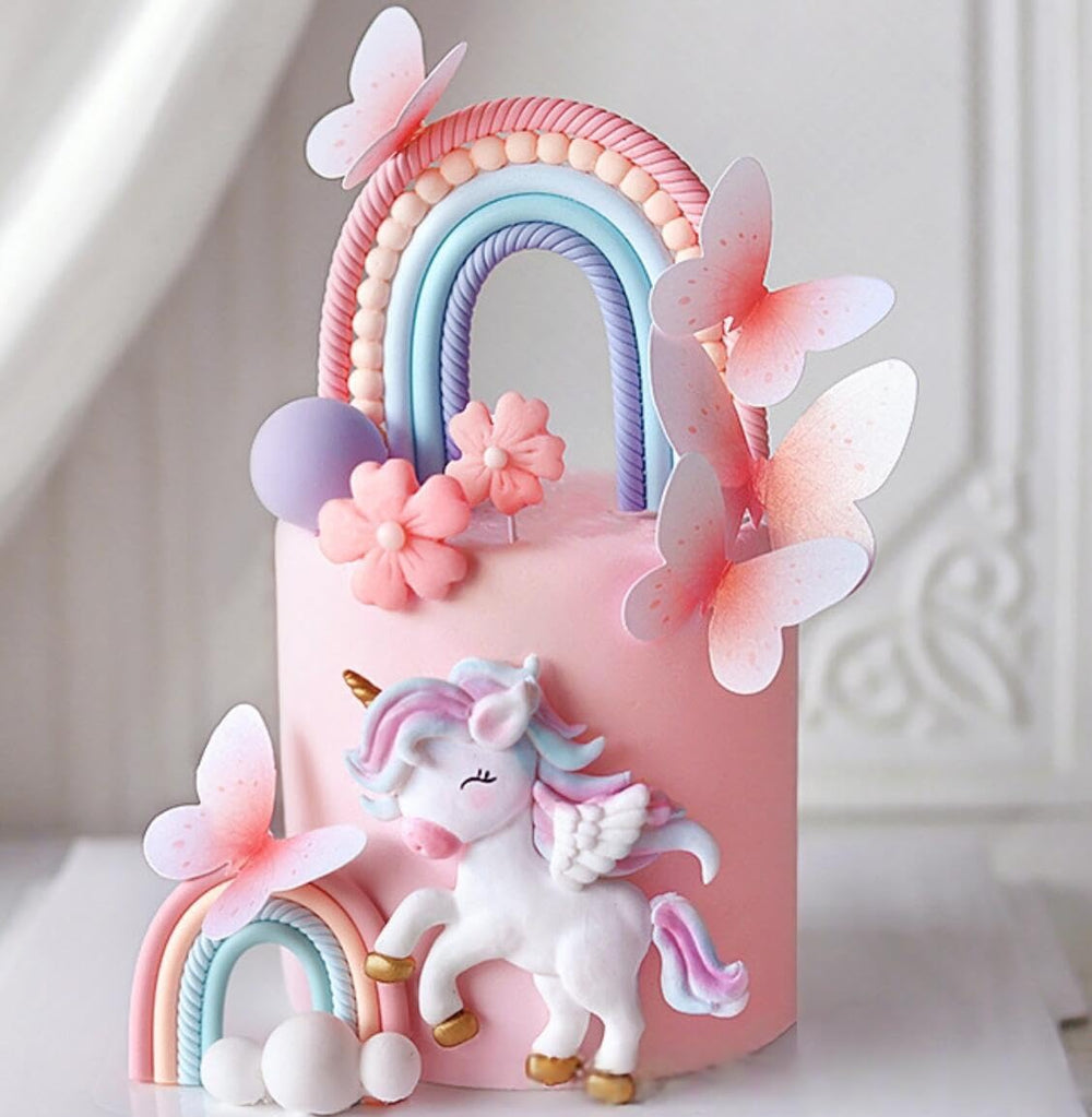 Bach and Boozy rainbow cake toppers brighten celebrations with pastel colors.