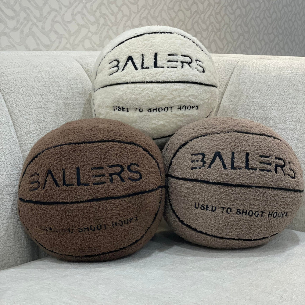 Ballers Plush Basketball Pillow doubles as sports decor for themed rooms