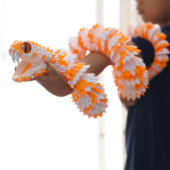 BANPIWOLG snake on office desk adding visual interest and conversation starter