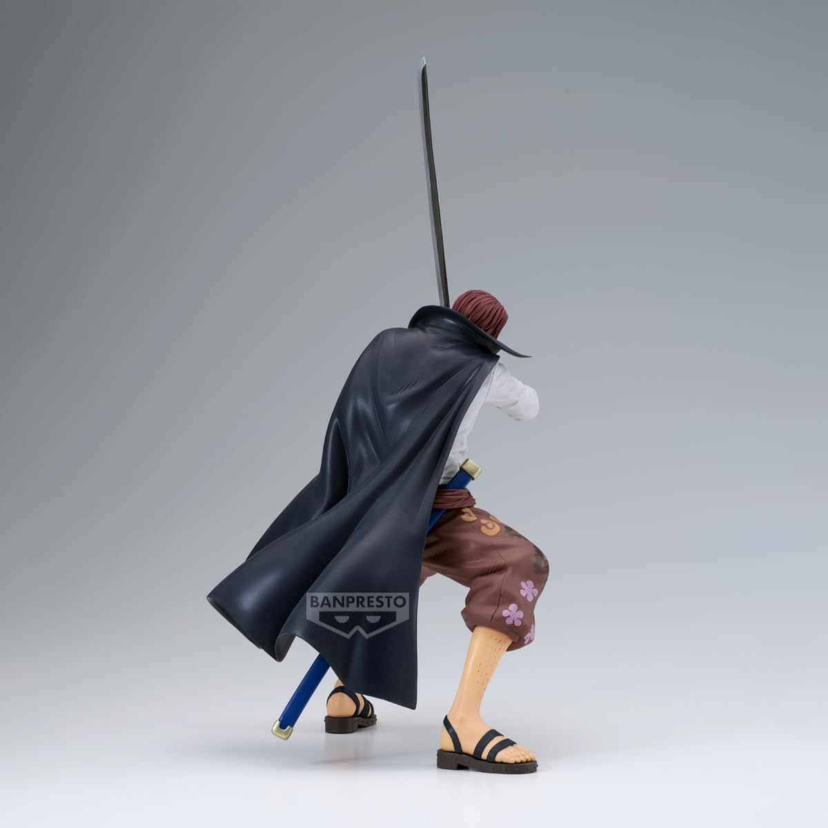 Banpresto Grandista Shanks figurine on desk adds focal point.