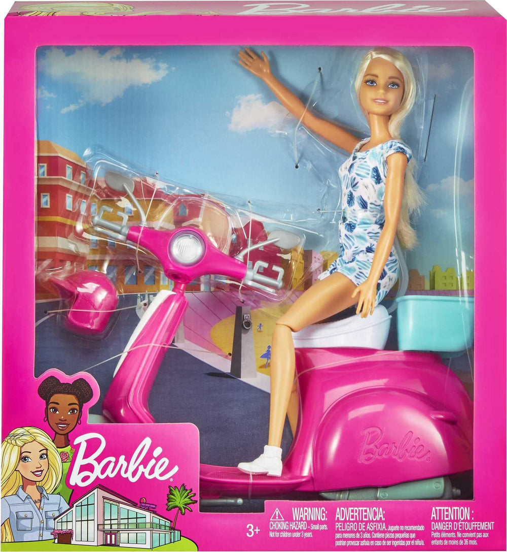 Barbie doll in printed romper and helmet ready for travel-themed play.