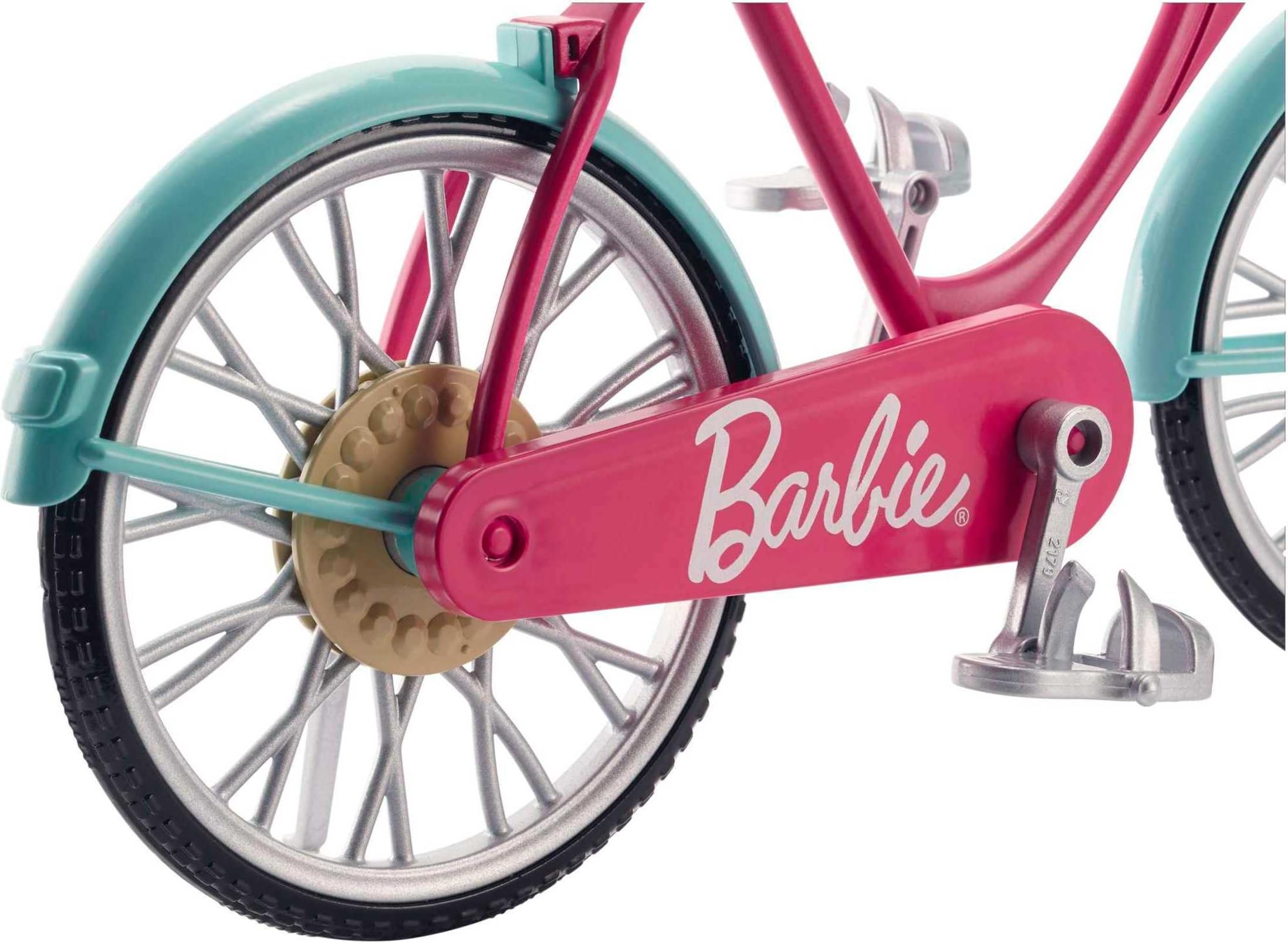 Barbie bicycle doll-seat clip keeps Barbie securely in place for pretend rides.