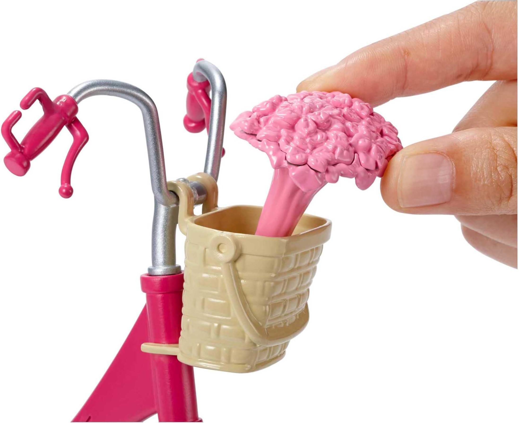 Barbie bicycle with silver accents that sparkle during playtime.