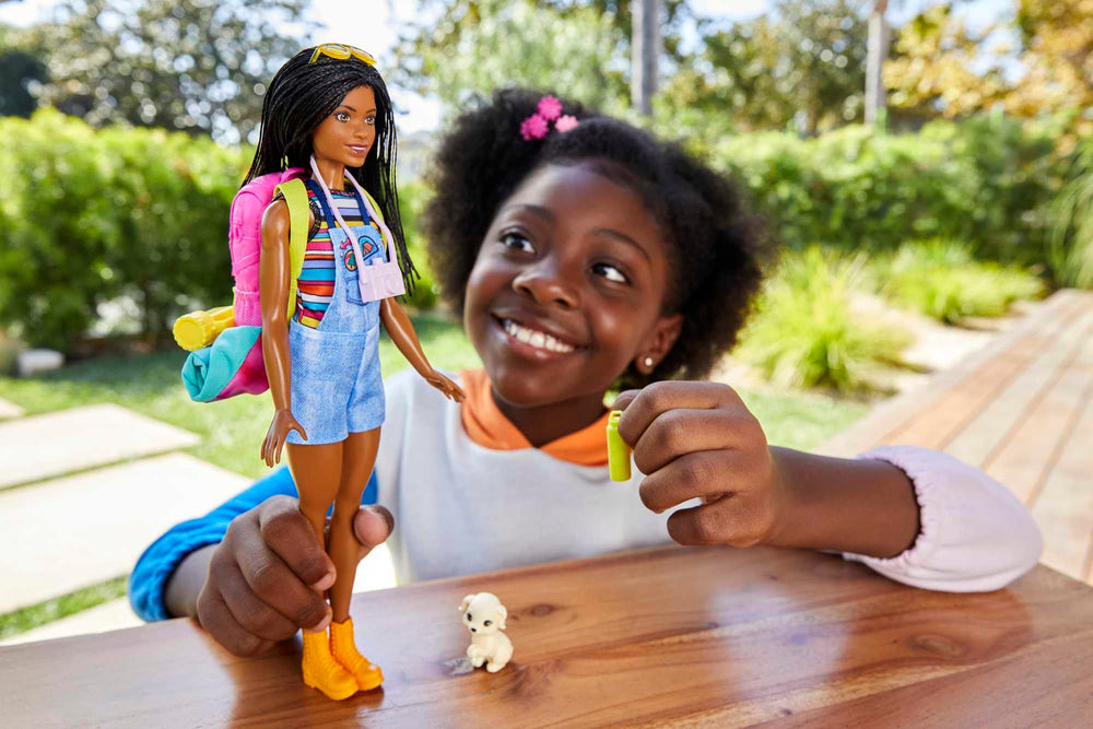 Barbie Brooklyn with puppy enjoying a cozy camping moment