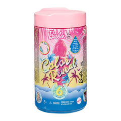 Barbie Chelsea Color Reveal doll in marble blue emerging from a clear tube