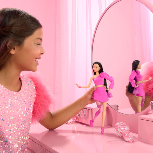 Barbie Deluxe Style doll with black hair and glitter prosthetic leg close-up.