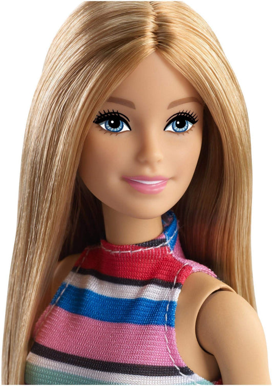 Barbie doll with five pairs of shoes provides mix-and-match fashion options.