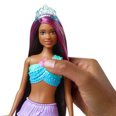 Barbie Dreamtopia mermaid with pink-streaked hair and crown for imaginative bath storytelling.