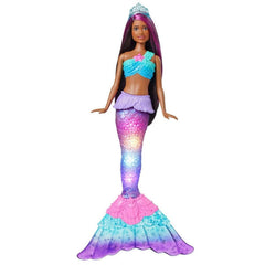 Barbie Dreamtopia mermaid with water-activated tail glowing during bath play.