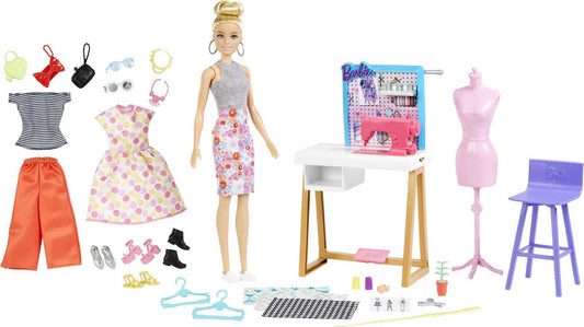 Barbie Fashion Designer Doll sketching designs at the desk for imaginative fashion.