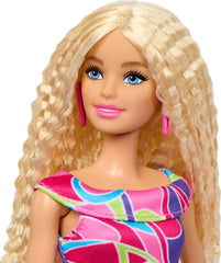 Barbie Fashionistas doll pink heels and earrings complete the outfit.