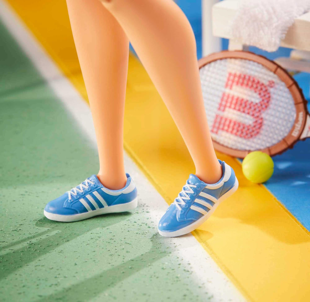 Wilson tennis racket with Barbie Billie Jean King doll for action poses