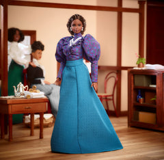 Barbie Inspiring Women Madam C.J. Walker puff sleeve blouse highlights timeless style and collector appeal.