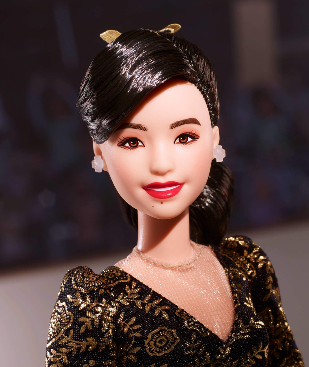 Kristi Yamaguchi gold-leotard Barbie showcases iconic Olympic style.