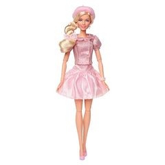 Barbie The Movie doll with beret and hair bow highlights chic headwear.