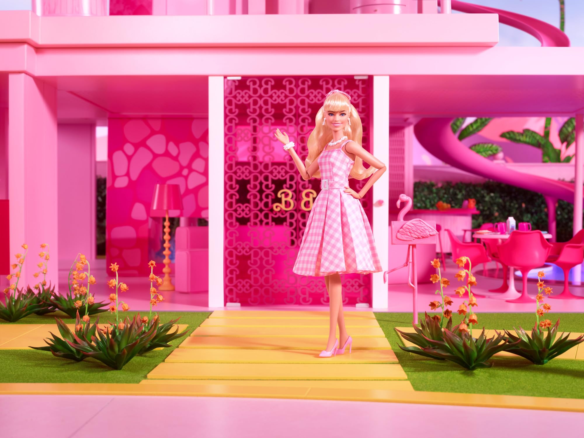 Barbie The Movie doll with a daisy chain necklace for a stylish pose