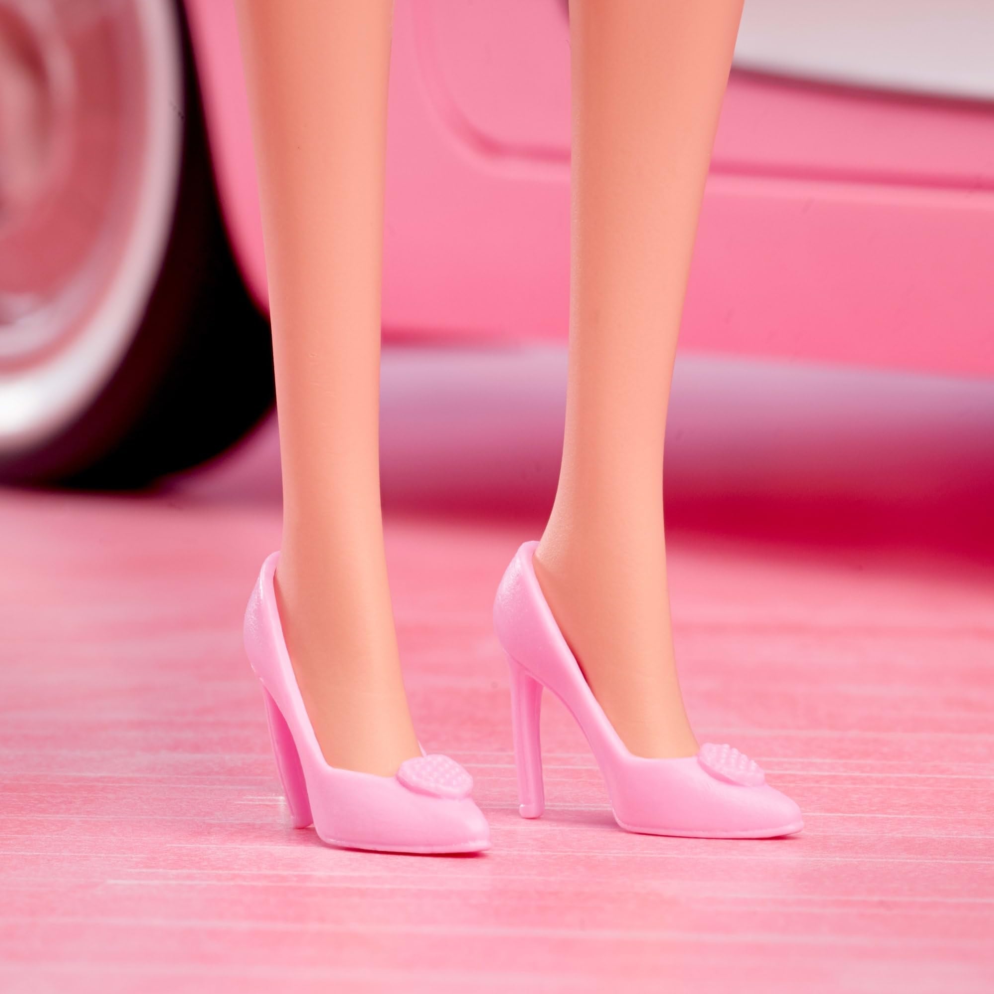 Barbie The Movie doll includes a display stand for showcasing.