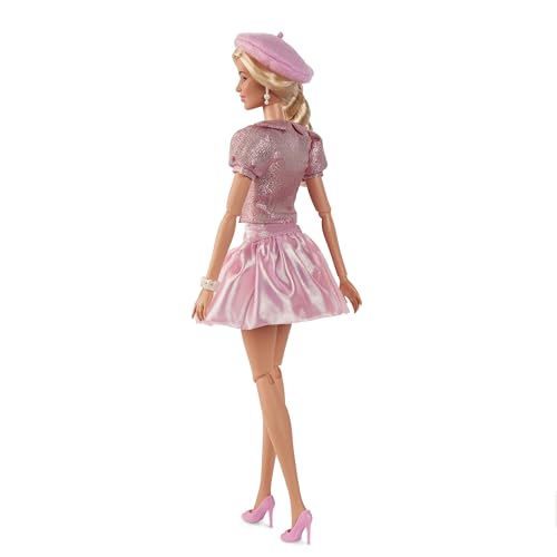 Barbie The Movie doll wears pearl earrings for a refined touch.