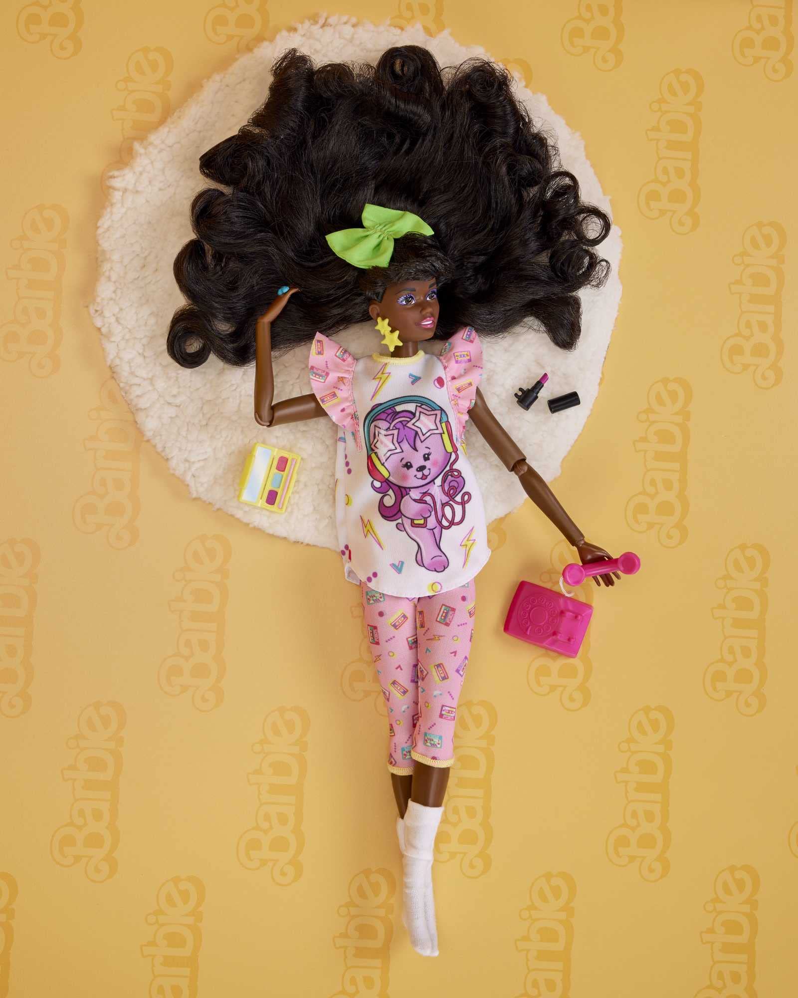 Barbie Rewind doll with big hair bow highlights 80s style at a sleepover