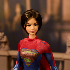 Barbie Supergirl cape flowing, ready for dramatic display.