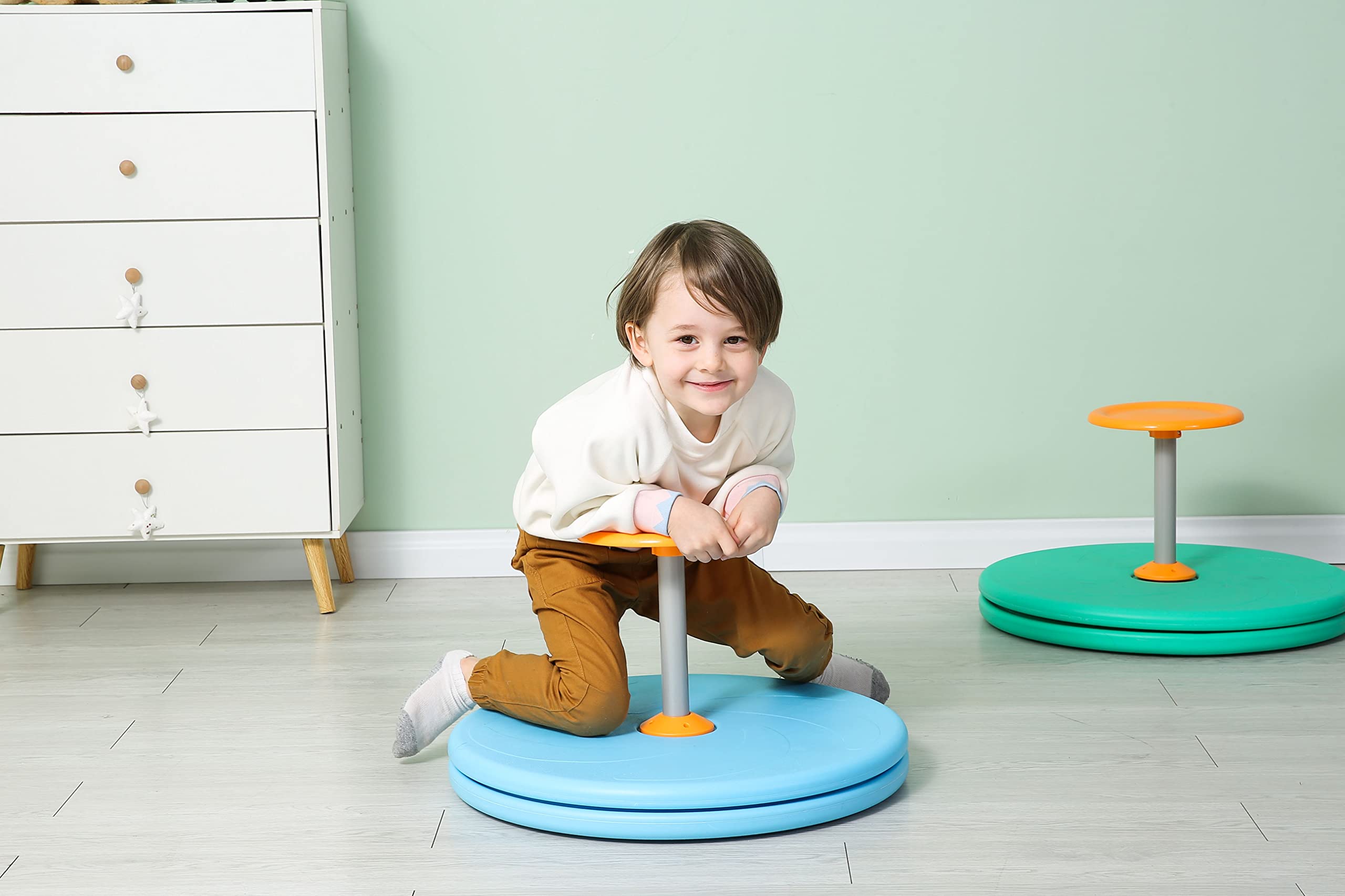 Spinner-X blue in motion showing spin action for sensory play