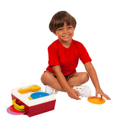 Child-focused scene of a kid playing with the Record Player.