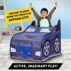 Batmobile tent in a playroom setup as Gotham backdrop.