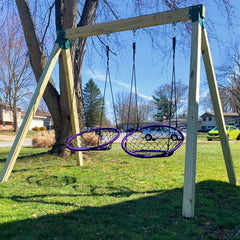 Two BETOOLL hangers with oval hooks ready for swing installation on cedar rafters