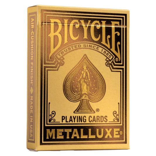 Bicycle Metalluxe gold foil playing cards on display, highlighting luxury and collectible appeal.