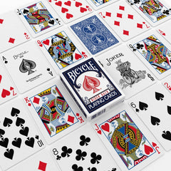 Bicycle Rider Back deck fanned on table showing red and blue backs.