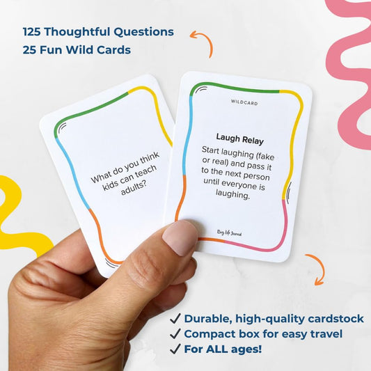 Big Life Journal conversation cards spread on dinner table to spark meaningful talks.
