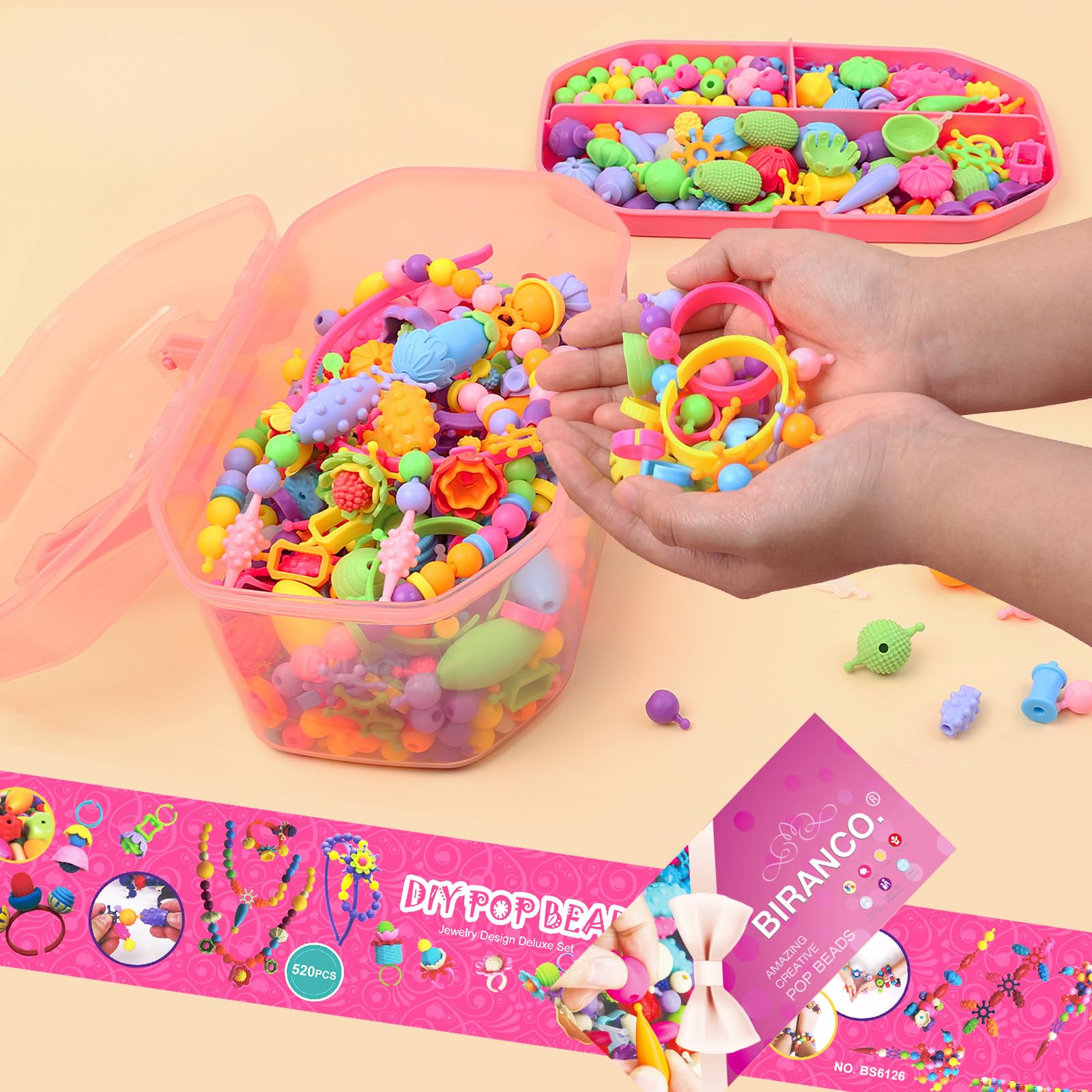 Biranco Pop Beads kit child wearing a bracelet crafted from snap beads.