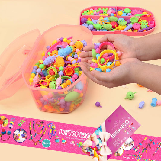 Biranco Pop Beads kit child wearing a bracelet crafted from snap beads.