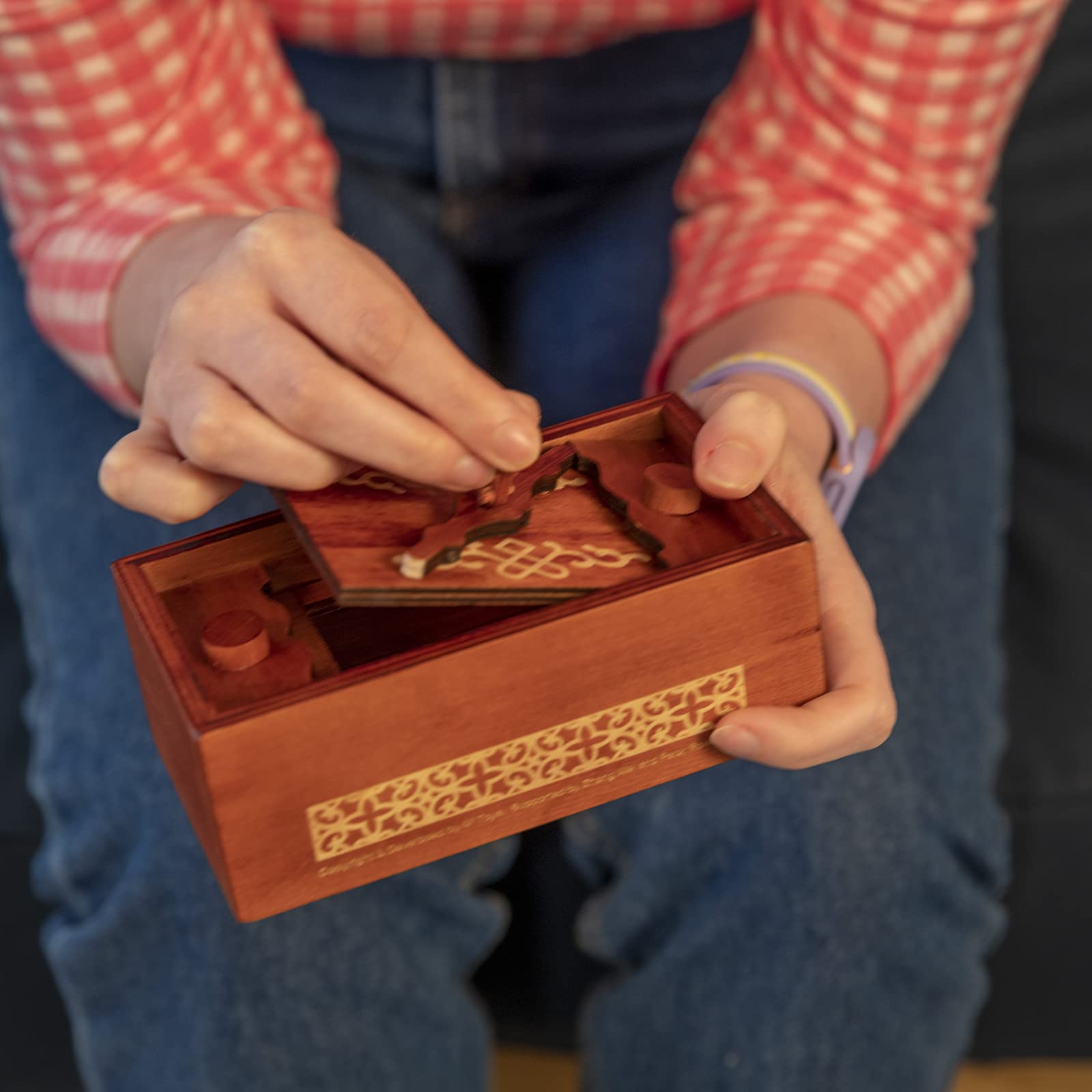 Bits and Pieces Secret Money Puzzle Box includes a complete guide to challenges