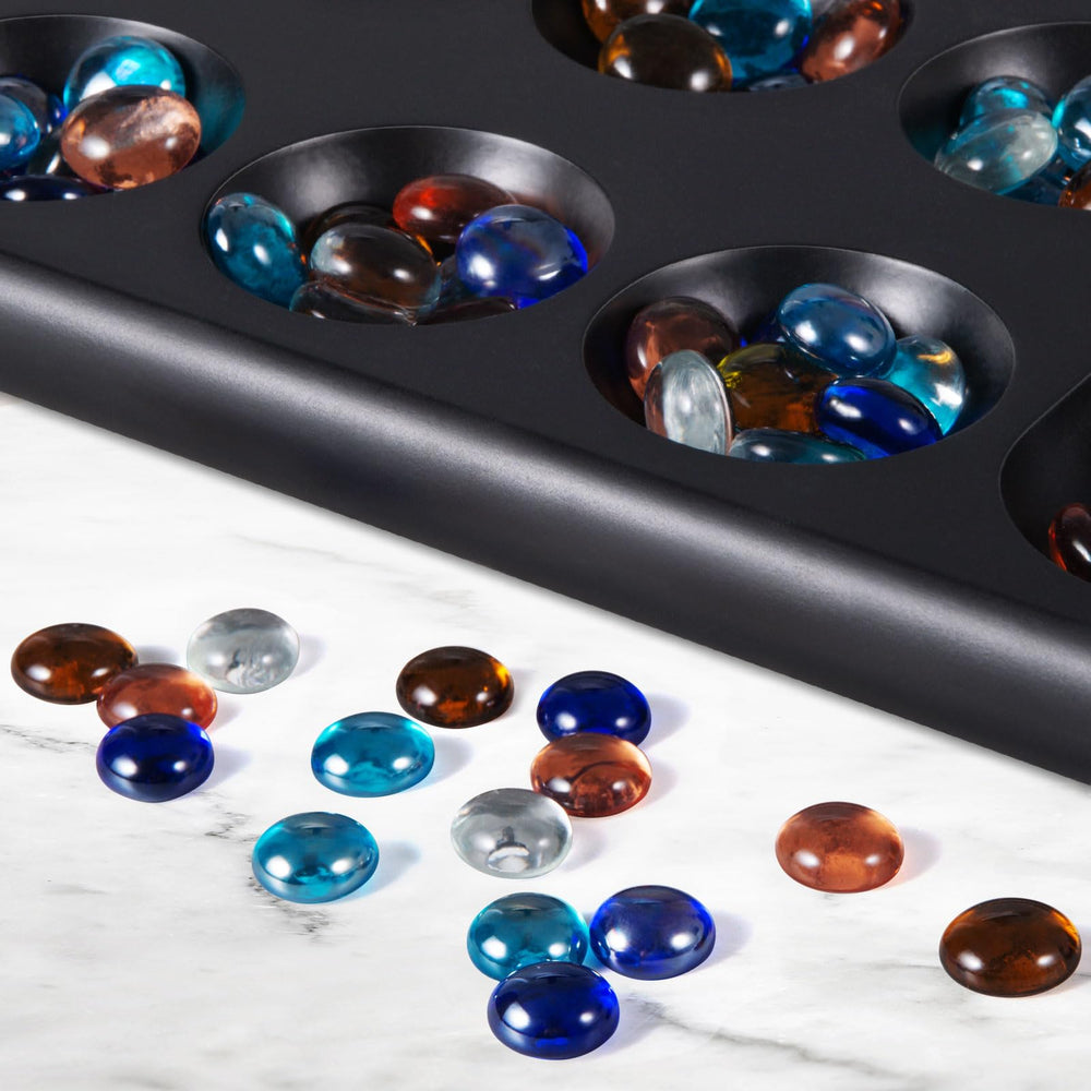 BIVOMON Two-player Mancala game in a cozy family setting.