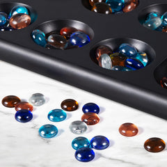 BIVOMON Two-player Mancala game in a cozy family setting.