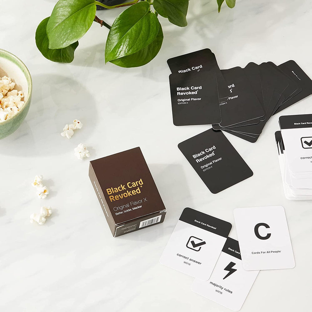 Black Card Revoked Edition X majority rule cards invite group decisions.