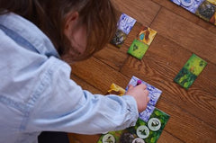 Dragomino egg tokens ready for collection during family play.
