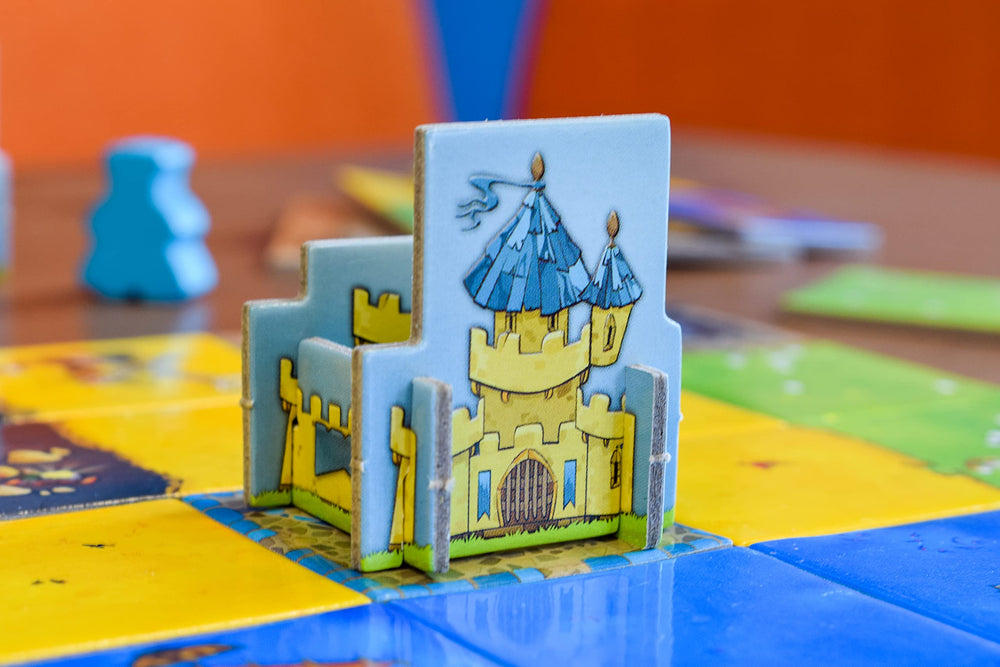 Blue Orange Kingdomino compact box—portable family game for travel.