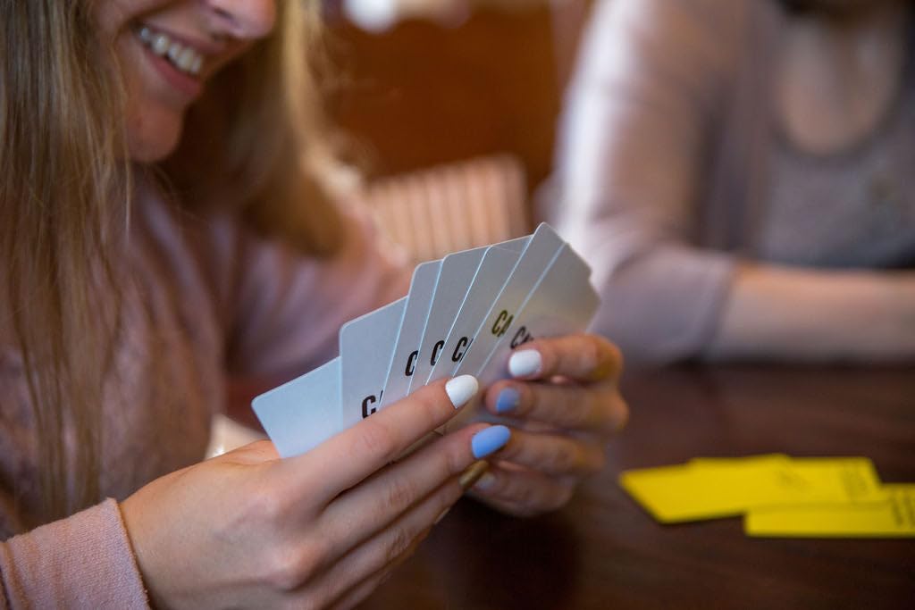 Closeup of The Catholic Card Game cards featuring vivid Catholic imagery.