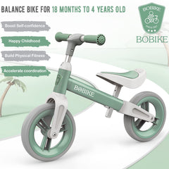 Bobike green balance bike with enclosed wheels for safe play