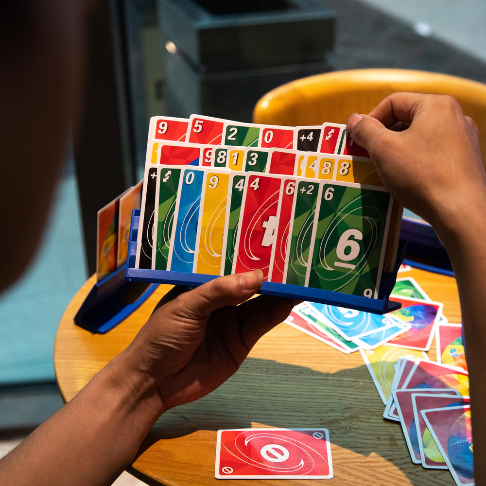 BORICO card holder stores up to forty cards, reducing bulk clutter at the table.