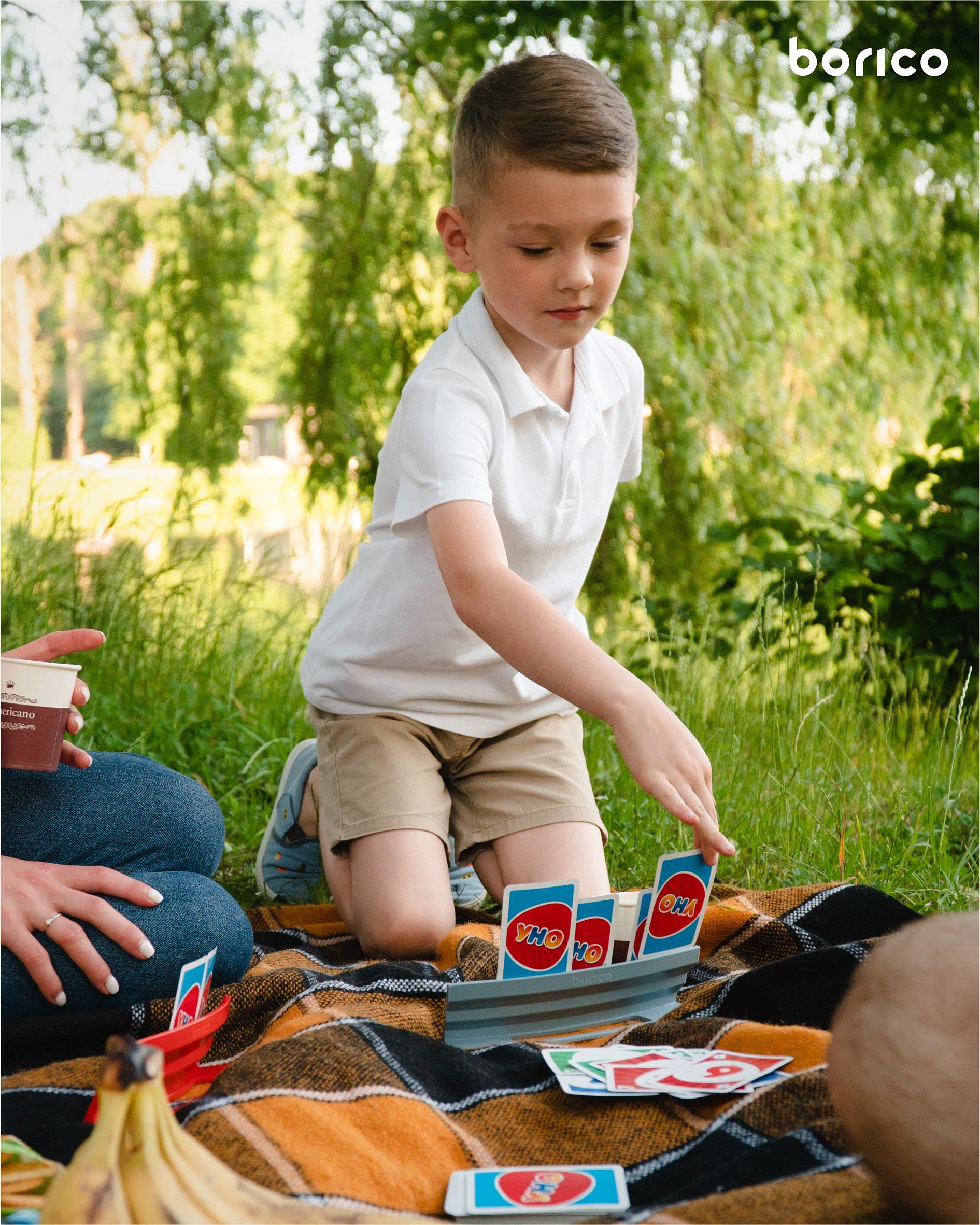 BORICO card holder on table provides anchored support to free hands during longer games.