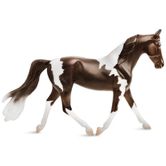 Breyer Freedom Series Pinto model horse with vibrant hand-painted coat for imaginative play.