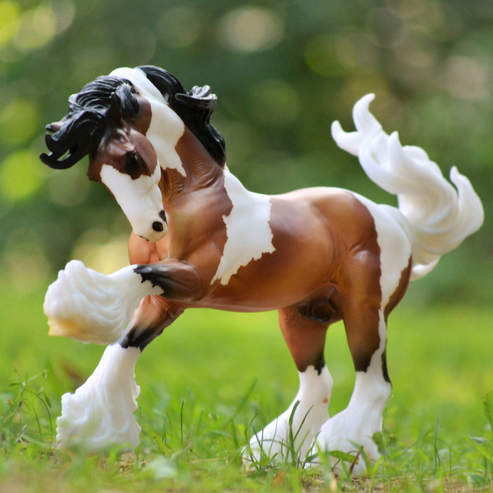Breyer Gypsy Vanner display piece adds equine elegance to any shelf.