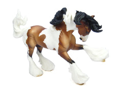 Breyer Gypsy Vanner with leg feathering, showcasing realistic detail for collectors.
