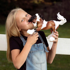 Breyer Gypsy Vanner model 1497 offers collectible value and durable construction.